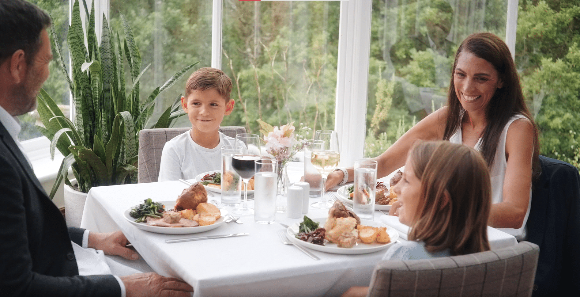 Family of four enjoying Sunday lunch at Salomons Estate